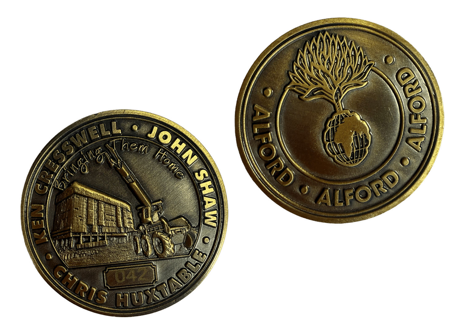 Two commemorative bronze coins with detailed engravings and text, shown front and back.